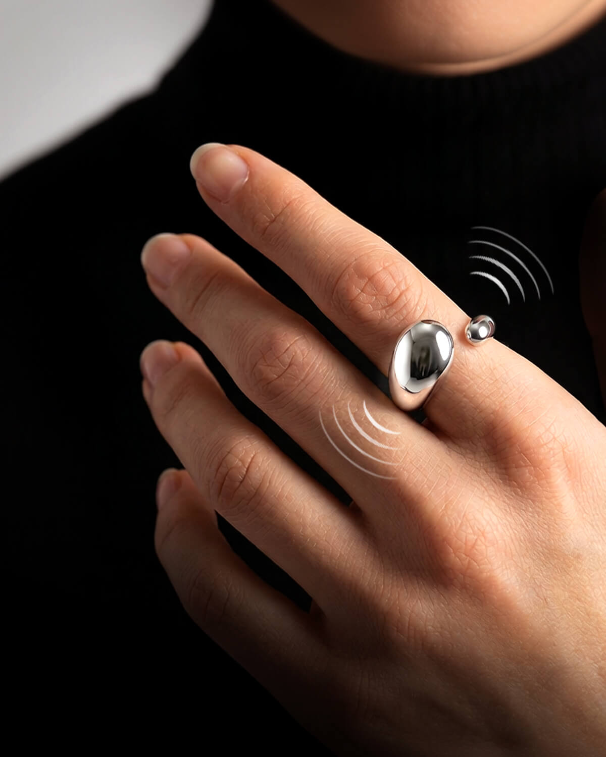 Catellect vibration ring on a hand maintaining presence with the cat