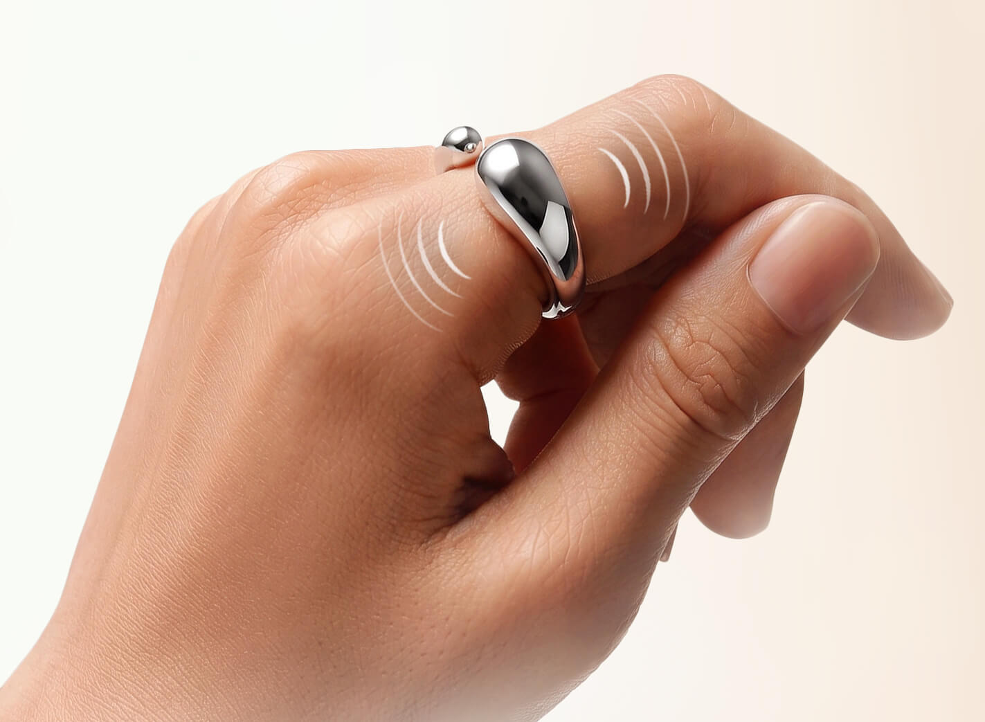 Catellect vibration ring on a hand maintaining presence with the cat